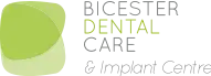 The Bicester Dental Care logo is a green shape with the words Bicester Dental Care next to it. It is an elegant design to convey high qualities of service.