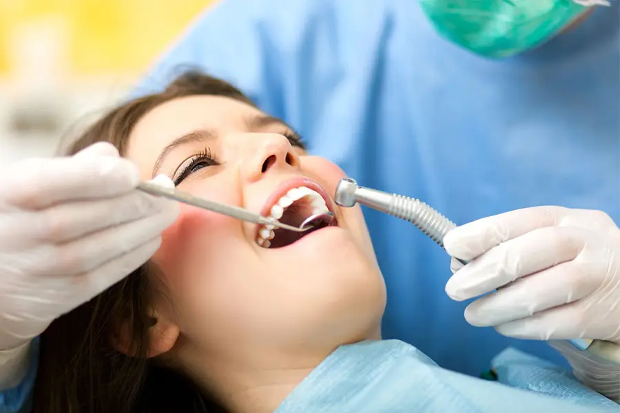 A patient at Bicester Dental receiving treatment and looking very calm and happy with the service.